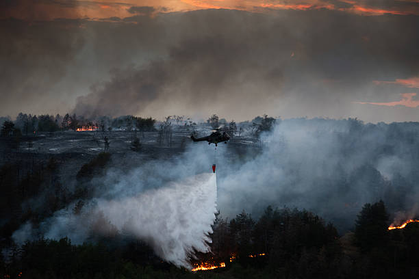 istock Helicopter dumping water on a wildfire 2224314050