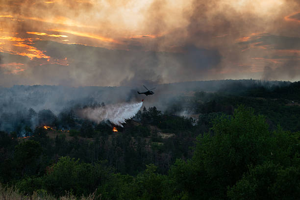 istock Helicopter dumping water on a wildfire 2224314124