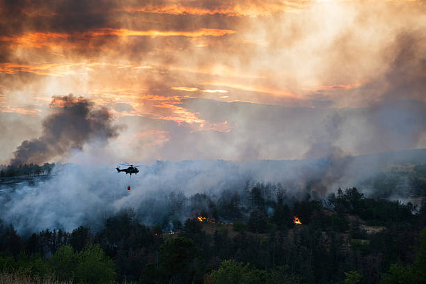 istock Helicopter dumping water on a wildfire 2224314129
