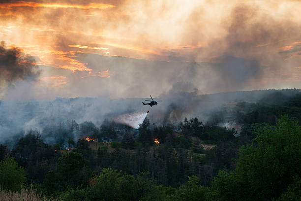 istock Helicopter dumping water on a wildfire 2224314131