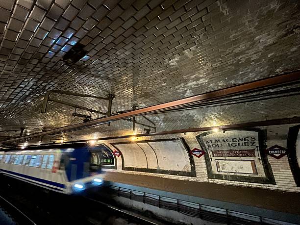 Madrid, Spain - July 5, 2025: Metro train crossing by Chamberi station in Madrid