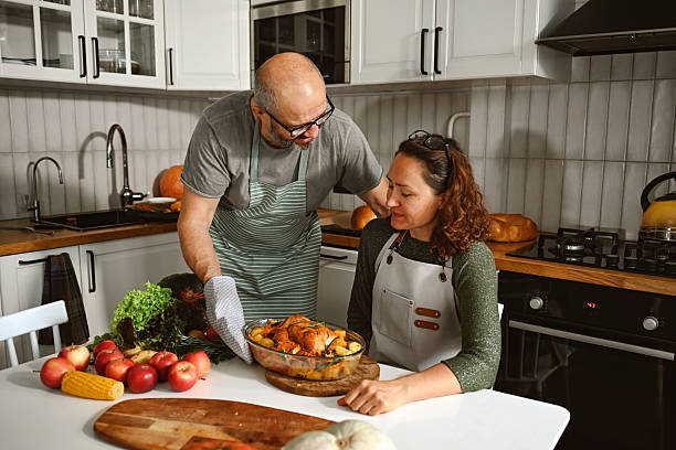 istock husband and wife are preparing a festive dinner 2224321651