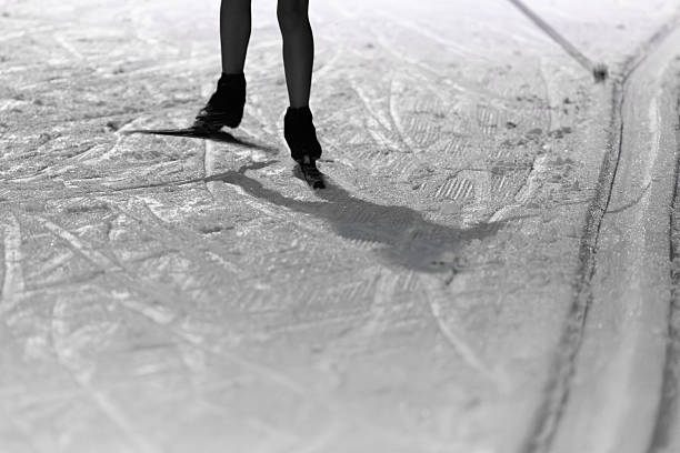 Close-Up of Ice Skating on Textured Ice Under Soft Spotlight