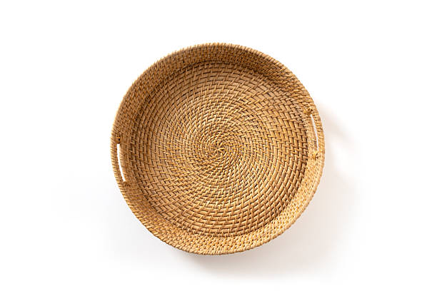 Wicker woven bamboo tray isolated on white background. Handmade by local craftsmen in sri lanka traditional tableware. View from above.