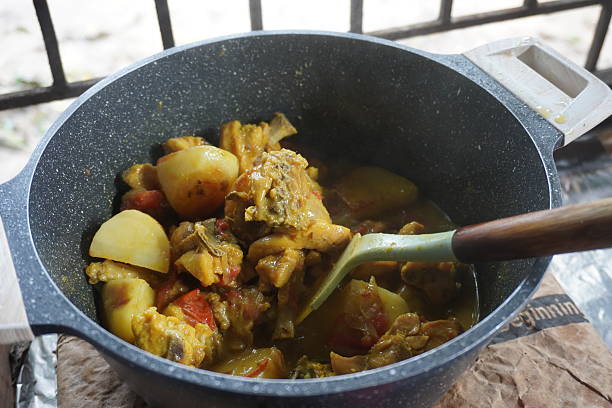 Chicken curry is stiring by a spatula