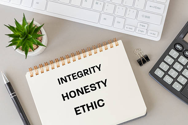 istock Integrity, honesty, and ethics. Conceptual symbol related to moral character and behavior. Integrity encompasses a person's adherence to strong moral principles and values. flat lay 2224326564
