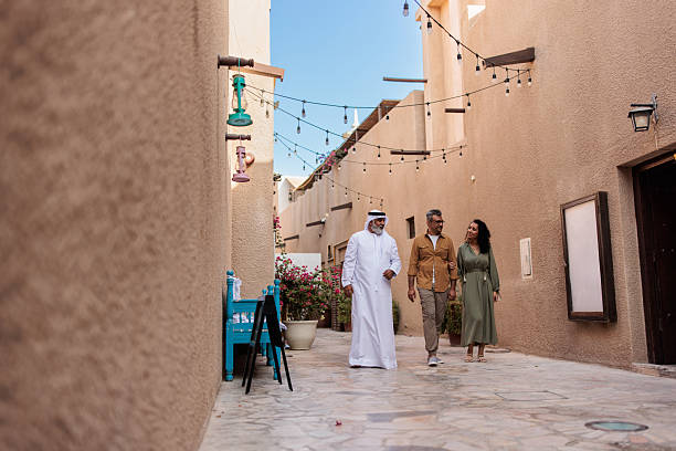 istock Tourists on Heritage Tour with Emirati Guide in Old Dubai 2224326862