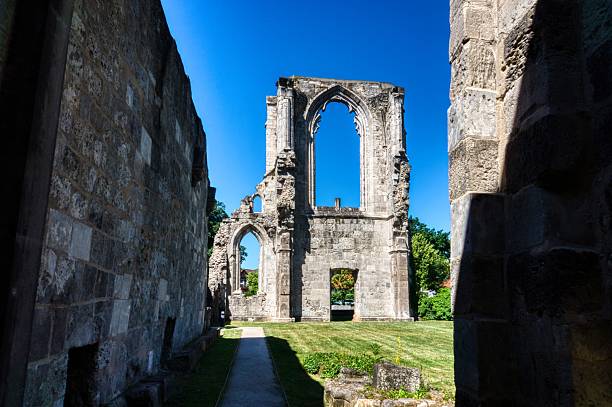 istock Historic stone ruin with archways under a blue sky. 2224327498