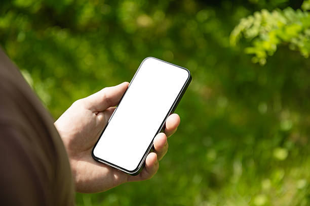 istock Man Hands Holding Smartphone in Outdoor 2224328788