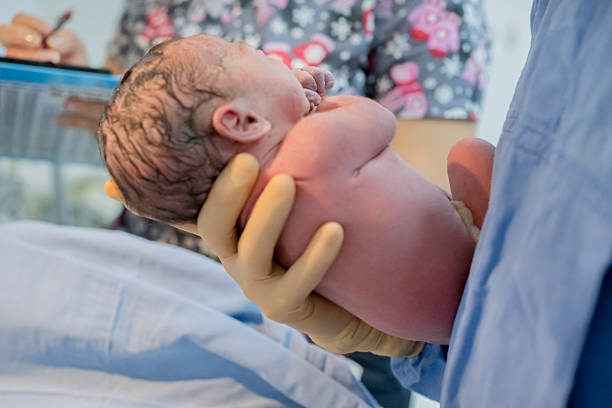 istock medical team in cesarean delivery process 2224329411