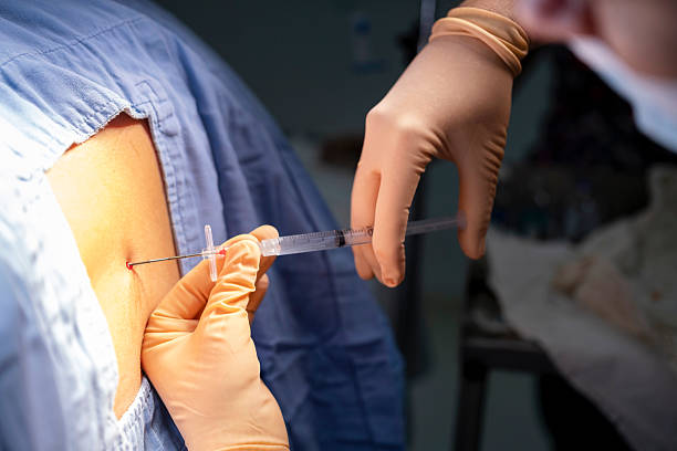 istock patient receiving spinal injection 2224330173