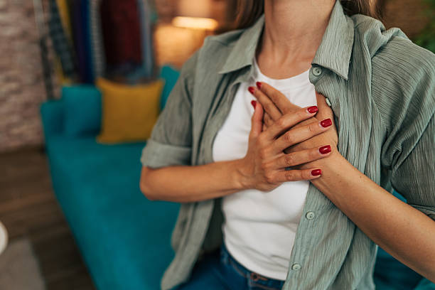 istock Woman suffering from chest pain, having heart attack or panic attack 2224330703