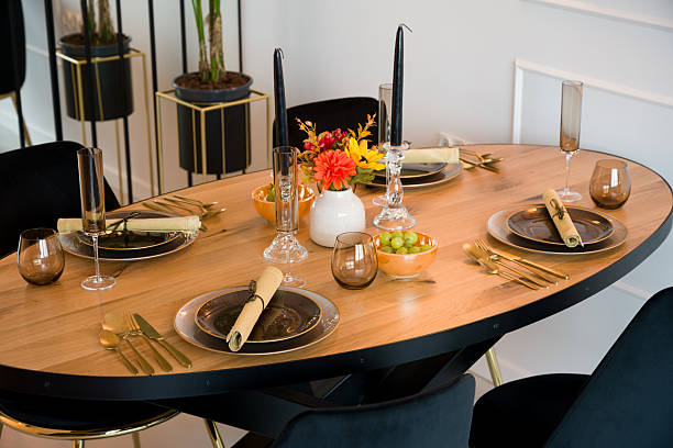 istock Elegant table setting on a wooden dining table for a festive dinner 2224330872