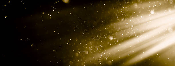 istock Golden Dust Particle Background - Blurred Light Texture with Lens Flare 2224335846