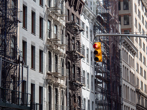 istock Typical houses in Manhattan with a traffic light in the foreground 2224335851