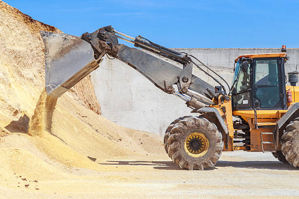 istock Bulldozer loads food for cows. 2224338579
