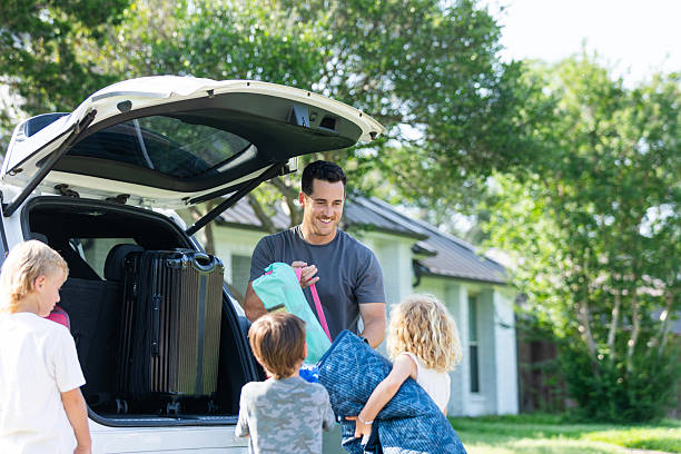 istock Happy Family Loading Car for Vacation, Packing for Trip 2224340922
