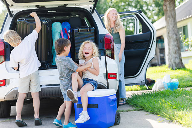 istock Happy Family Loading Up for a Summer Vacation Trip 2224340928