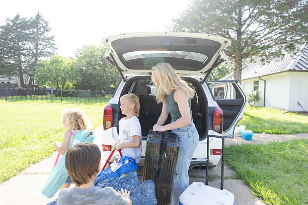 istock Family Packing Car for Summer Vacation, Loading Luggage 2224340937