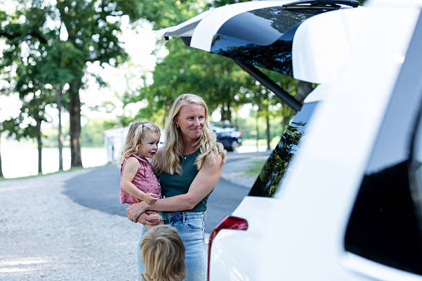 istock Happy Family Loading Car for a Summer Vacation 2224340939