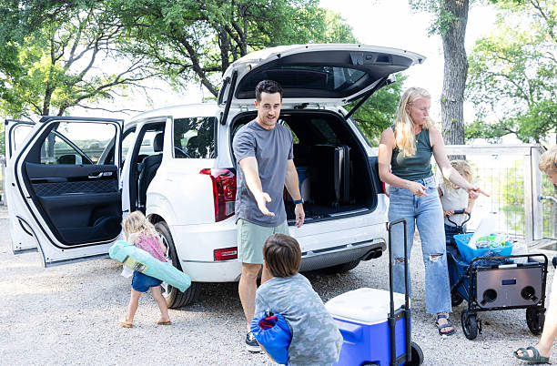 istock Family Packing Car for Camping Trip, Loading Luggage 2224340965