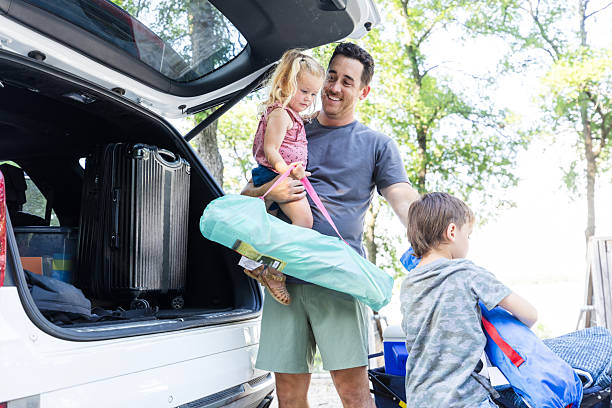 istock Happy Family Packing for a Camping Adventure 2224340978