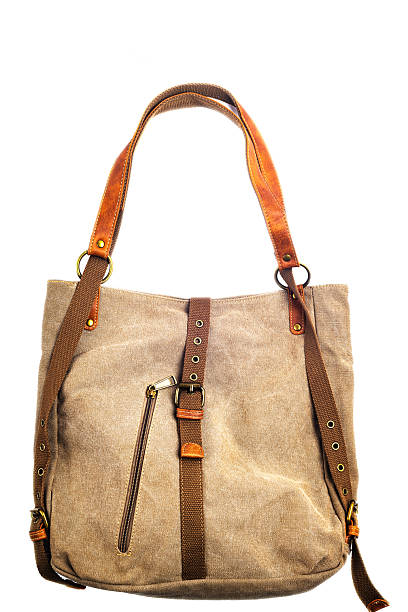 istock canvas bag-backpack with leather trim on a white background. 2224344506
