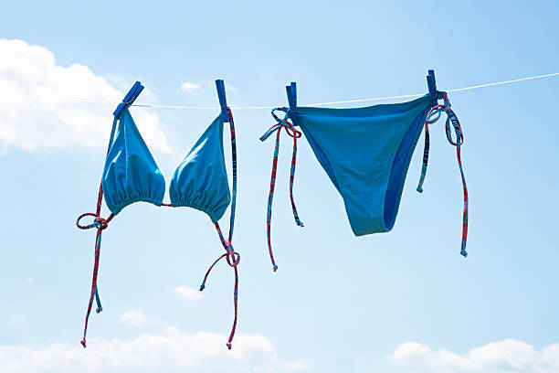 istock Swimsuit hanging on a line to dry 2224348197