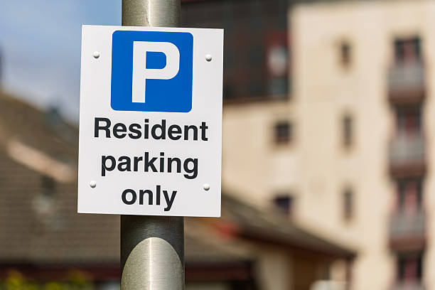istock Resident Parking Only Sign with Blurred Urban Background 2224387633