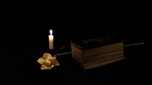istock Ancient Book, Candle and Narcissus 2224388796