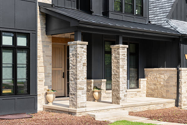 istock A front door detail on a black and stone sided home. 2224390028