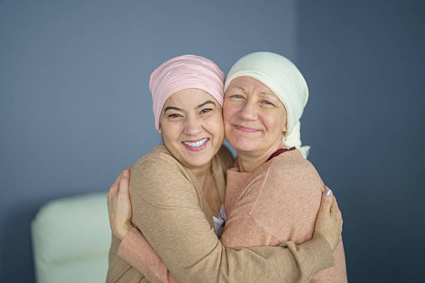 istock Women Embracing Each Other While Smiling in Supportive and Caring Moment 2224395475