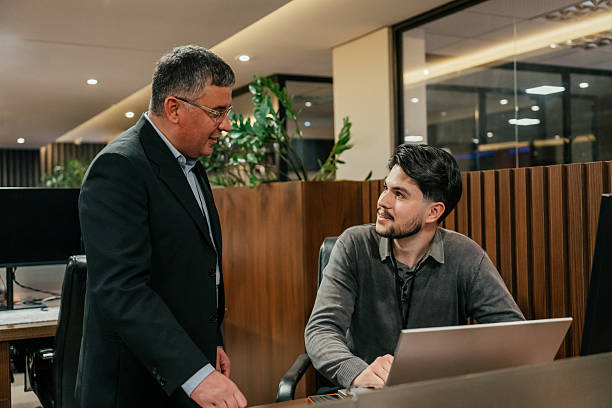 istock Two colleagues talking in the office 2224395554