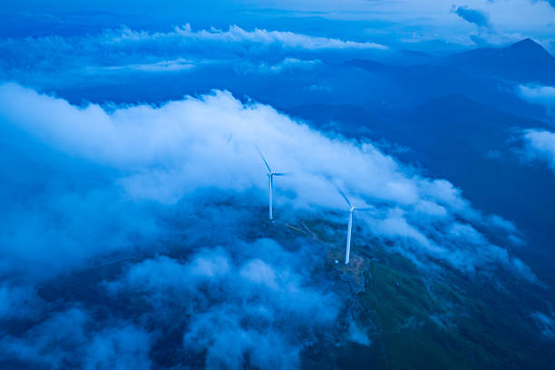 Wind power generation and clouds on the mountains