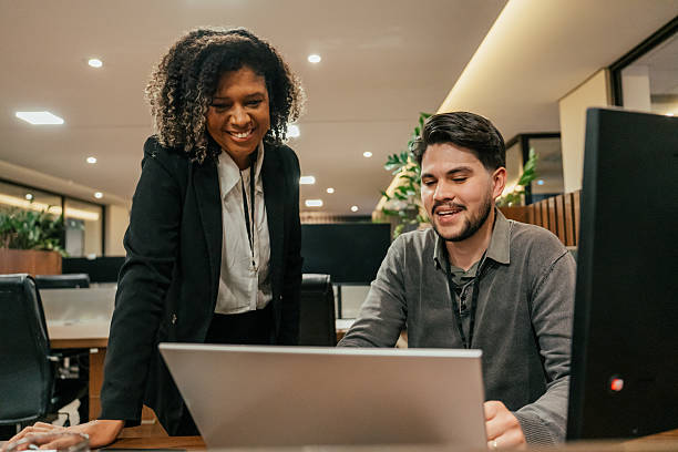 istock Two colleagues talking in the office 2224395981