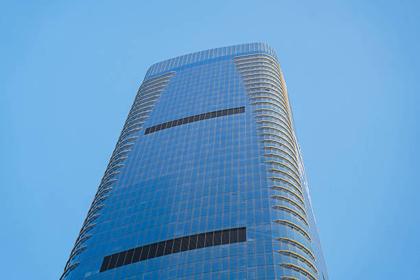 istock Low angle view of skyscraper with glass window and clear blue sky background for business and finance concept 2224396830