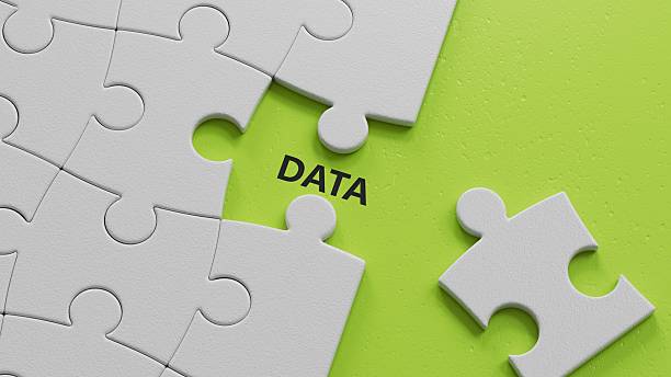 istock data.The white puzzle pieces with missing pieces spelling.Flat lay view from above on The white puzzle pieces with missing pieces buttons.IT technology concept.3D rendering on green background. 2224398492