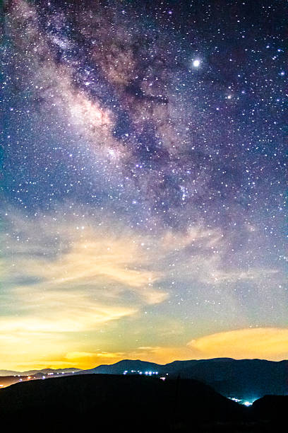 istock Milky Way over a town with night lights, Zimapan, Hidalgo 2224398732