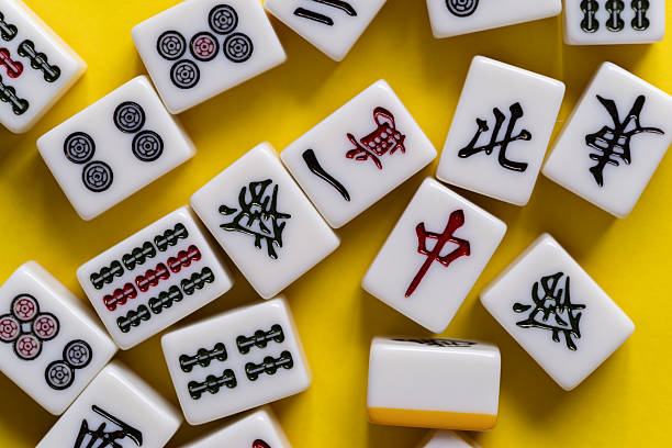 istock Mahjong tiles lined up on a yellow background 2224399065