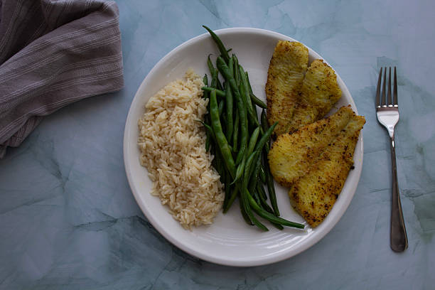 istock Pan-Seared Sole Fillet with Green Beans and Rice 2224399434