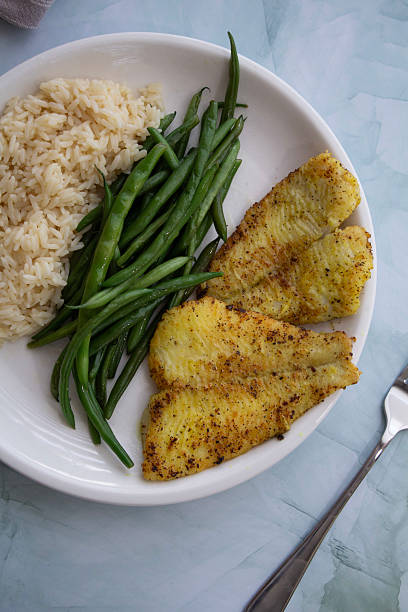 istock Pan-Seared Sole Fillet with Green Beans and Rice 2224399435