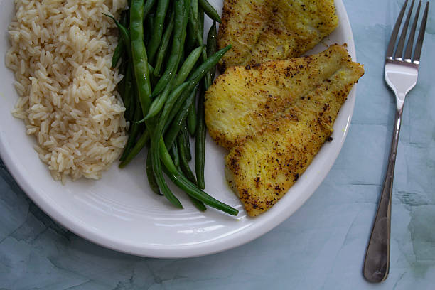 istock Pan-Seared Sole Fillet with Green Beans and Rice 2224399437