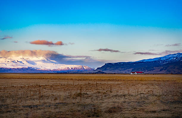 A vast farm under the glacier before sunrise