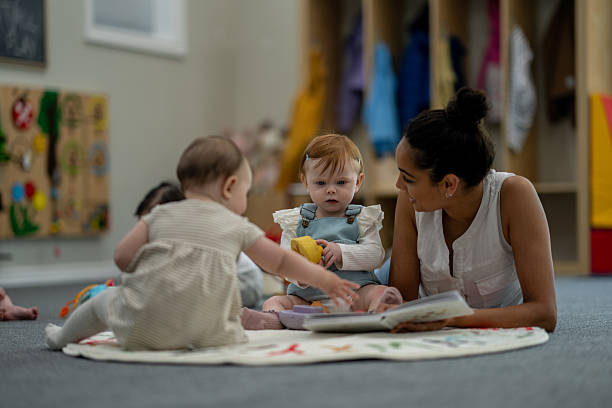 istock Teacher Engaging With Children During Playtime in a Colorful Classroom Environment 2224402227