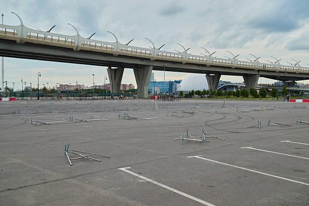 istock An Empty Parking Lot Located Beneath a Bridge Surrounded by Abandoned Bicycle Racks 2224404438