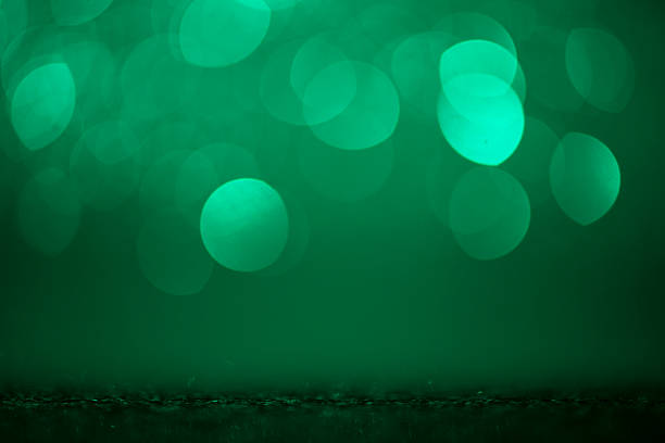istock A fresh green bokeh haze and shimmering glitter dissolve into a warm color gradient, creating versatile copy space for healthy lifestyle and corporate headers. 2224406366