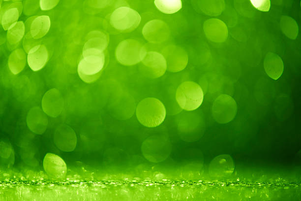 In this green color abstract bokeh backgrounds, defocused, blurred, glowing circle orbs float over a smooth color gradient, dusted with micro glitter to add texture and sparkle. The wide copy space and focus on foreground make it a turnkey template for web banner, header  design element, marketing, sale, or business useideal for campaigns centered on nature, environment, environmental issues, sustainable lifestyle, healthy lifestyle, freshness, and springtime events.