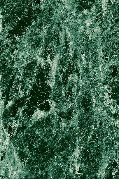 Real closeup of dark green marble stone texture surface background. Design pattern with high resolution for luxury home decoration. Abstract matt slab rock material. Front view of natural tiles stone surface.