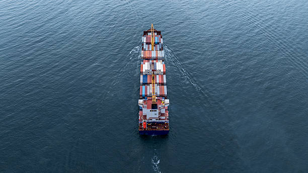 istock Aerial view from drone, Container ship or cargo shipping business logistic import and export freight transportation by container ship in open sea, Container loading cargo freight ship boat. 2224408489