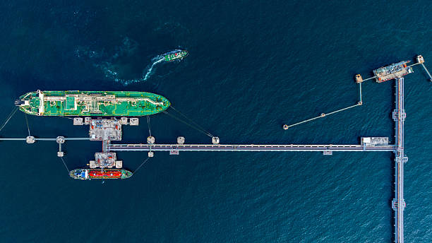 istock Aerial view lpg tanker ship vessel loading and unloading in oil terminal refinery, Global business import export logistic transport sea freight cargo lpg tanker ship, LPG tanker ship at port, Liquefied petroleum gas. 2224408522
